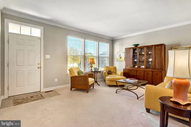a kitchen with stainless steel appliances granite countertop a refrigerator and a stove