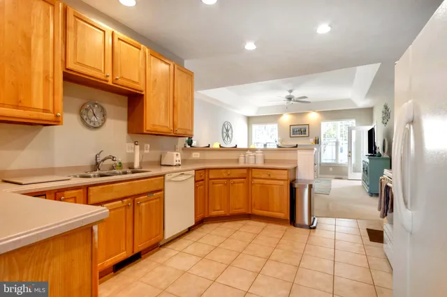 a spacious bedroom with a bed and a chandelier