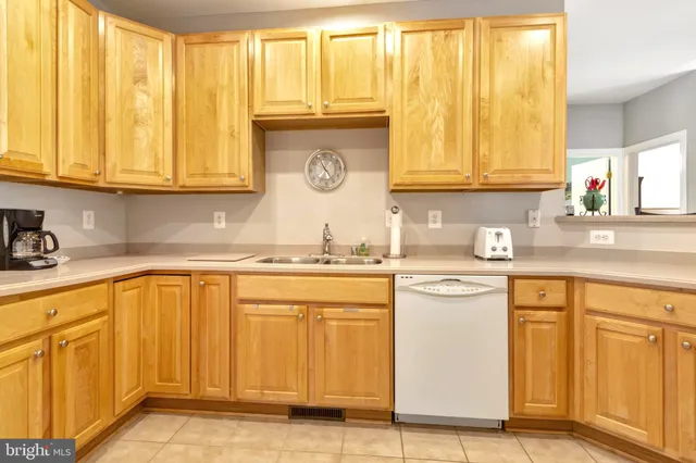 a room with furniture a rug and a window