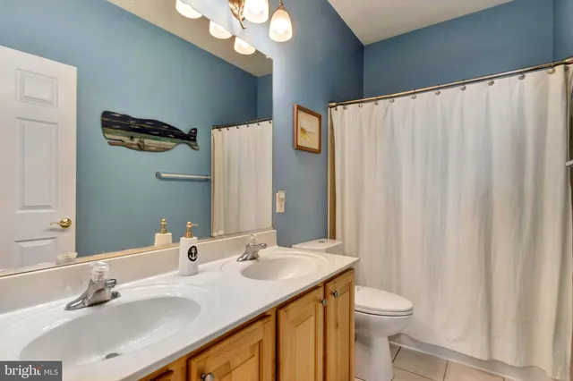 an aerial view of residential building with green space