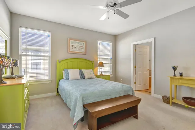 an aerial view of residential houses with outdoor space and swimming pool