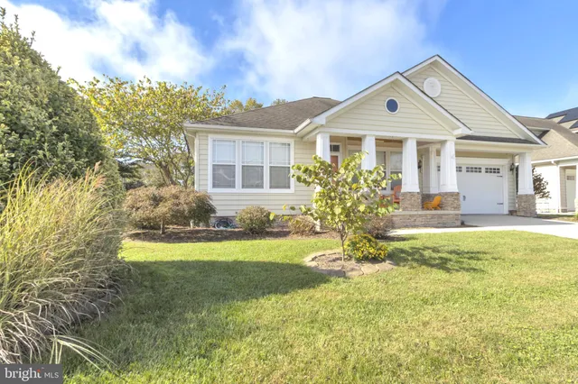 a living room with furniture and a lamp