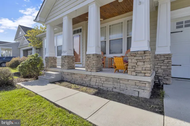 a living room with furniture window and a flat screen tv