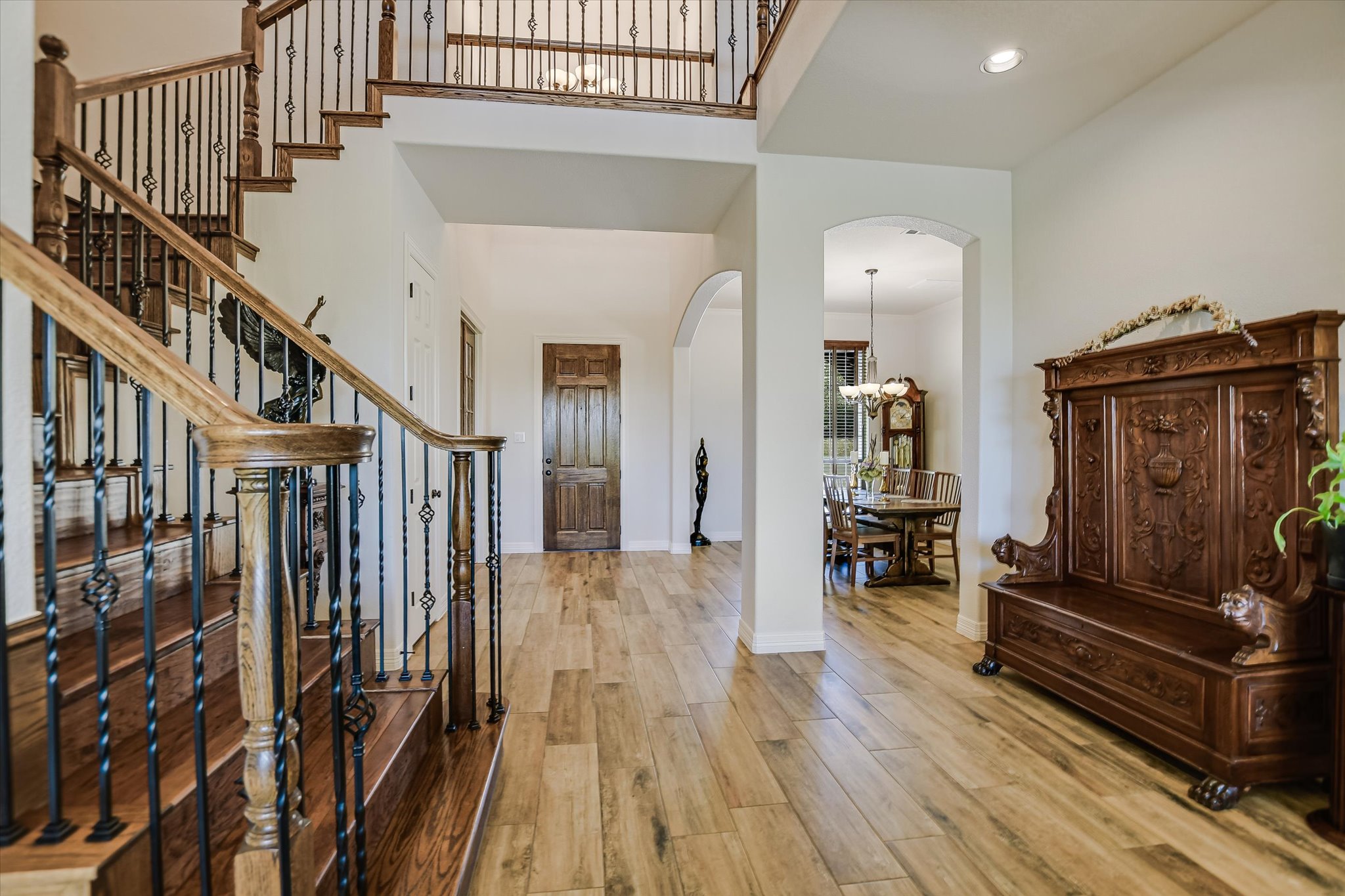 2404 First View Leander, TX 78641 - Photo 11 of 38 a view of a hallway with wooden floor and staircase
