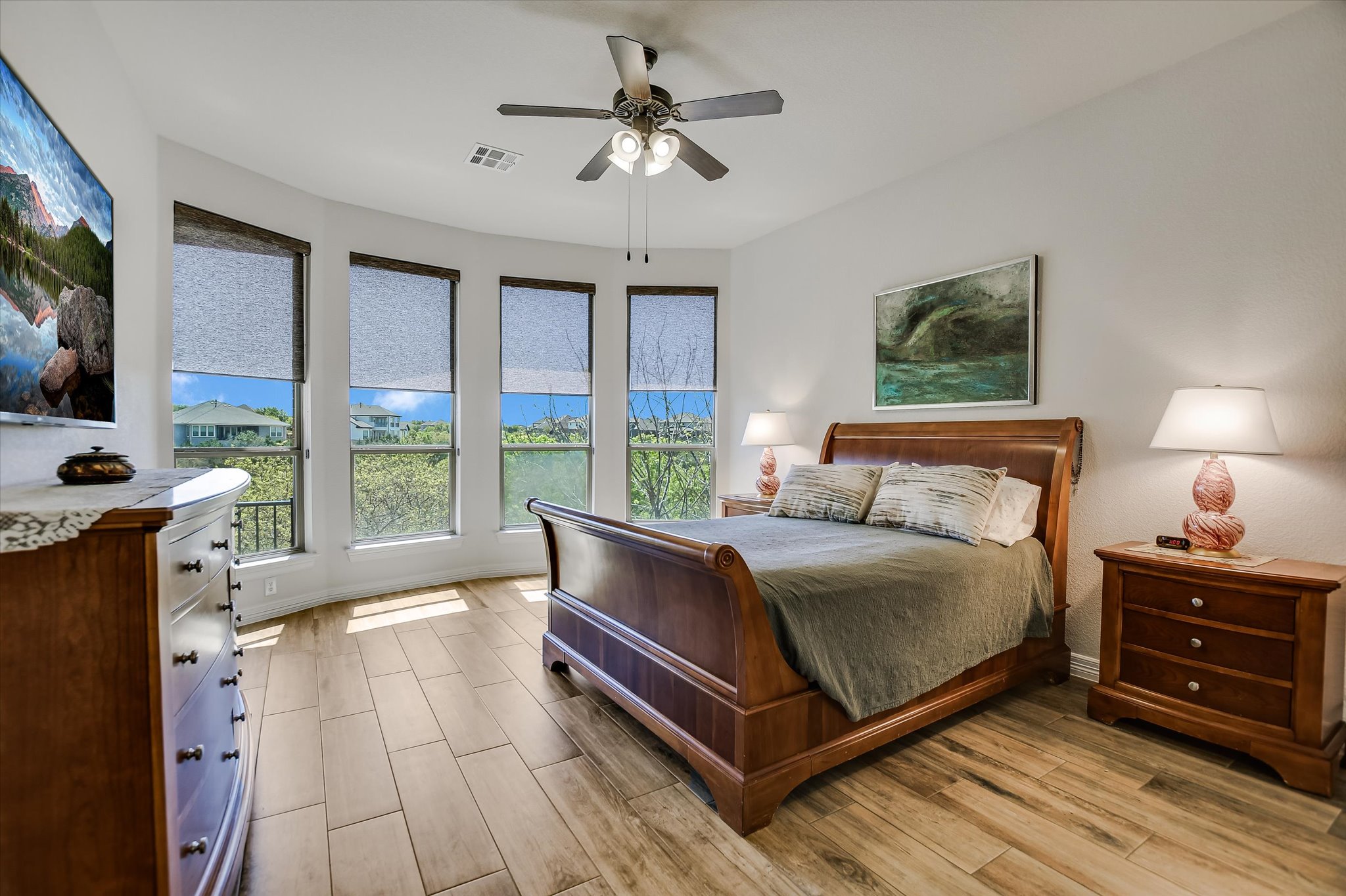 2404 First View Leander, TX 78641 - Photo 16 of 38 a bedroom with a bed and a flat tv screen on dresser
