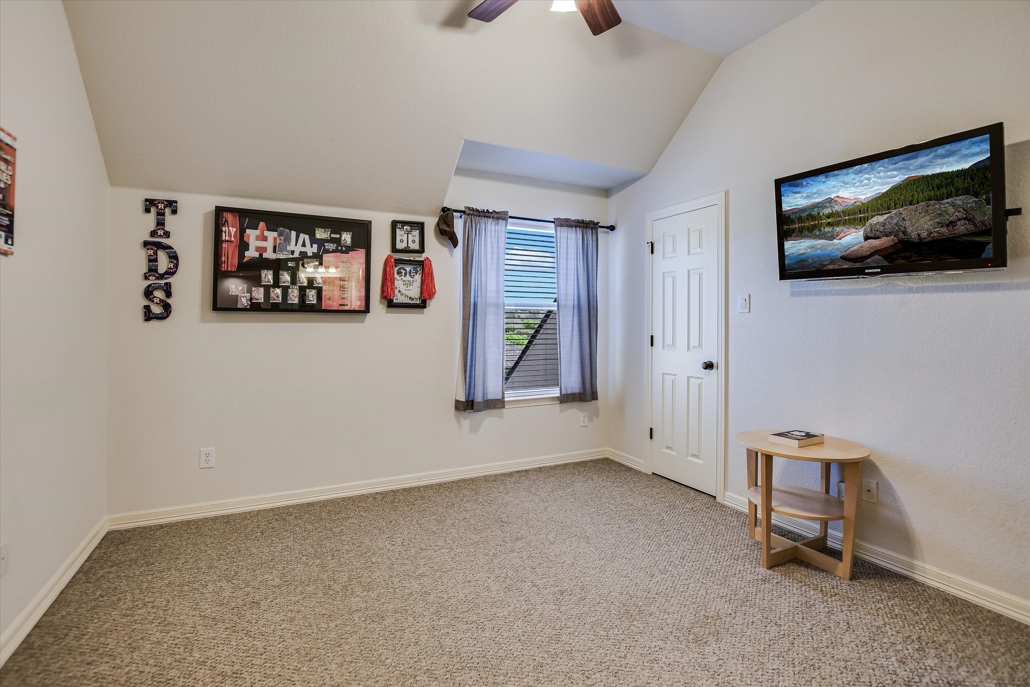 2404 First View Leander, TX 78641 - Photo 20 of 38 a view of an empty room with workspace and a flat screen tv