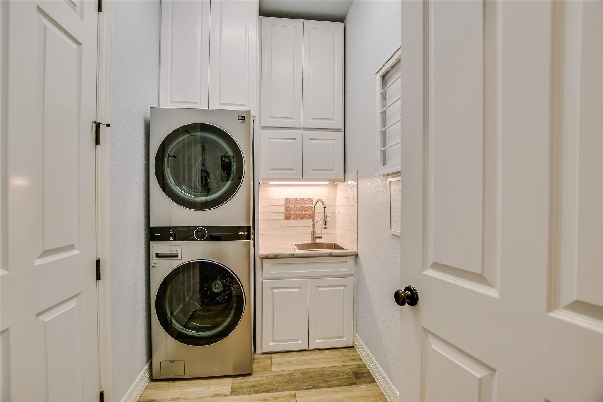2404 First View Leander, TX 78641 - Photo 27 of 38 a utility room with sink dryer and washer
