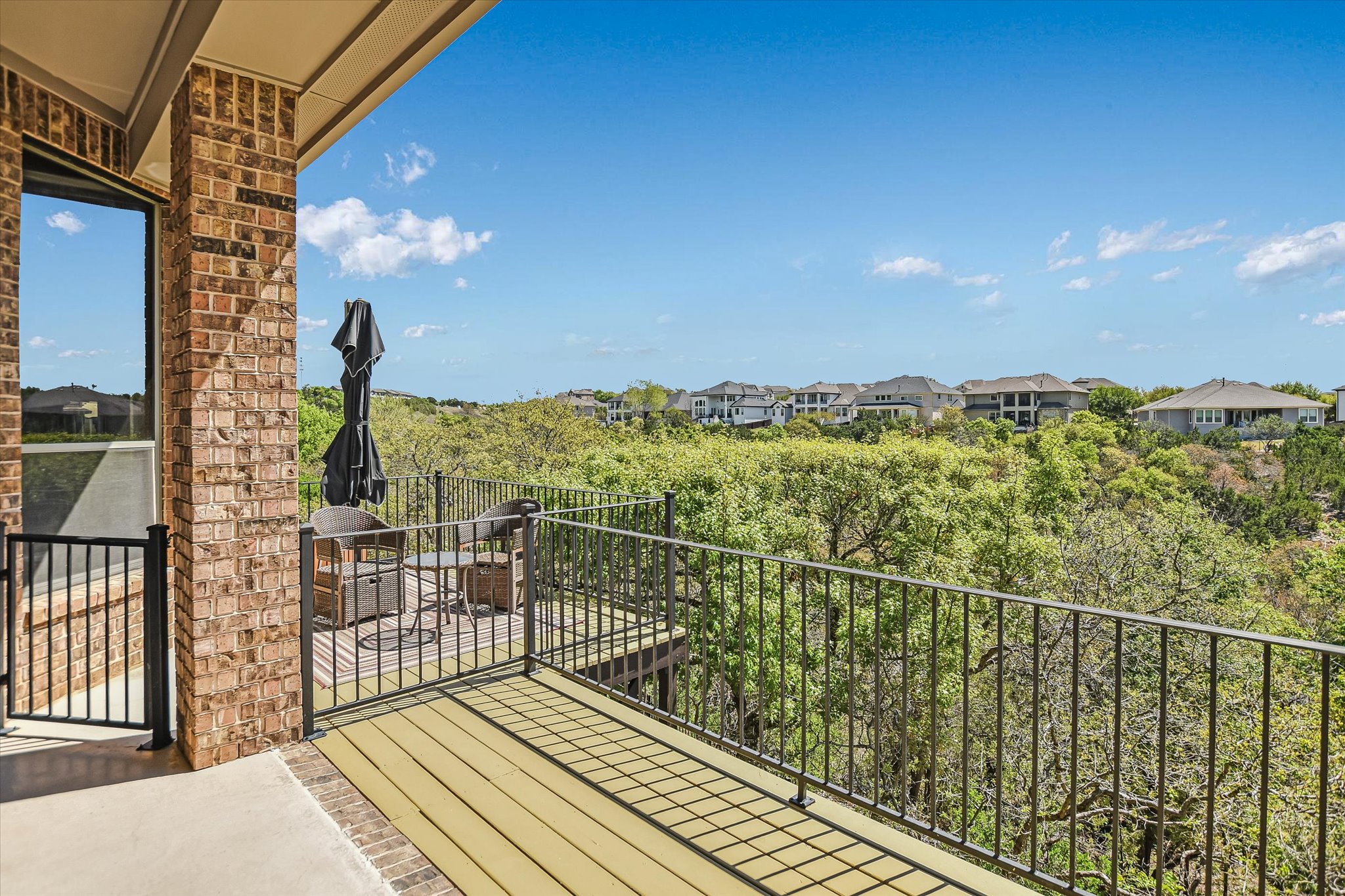 2404 First View Leander, TX 78641 - Photo 28 of 38 a view of a balcony with wooden floor and fence