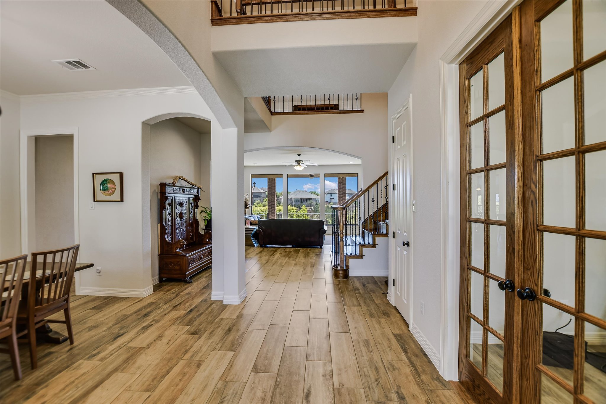 2404 First View Leander, TX 78641 - Photo 4 of 38 a view of a hallway view with wooden floor and staircase