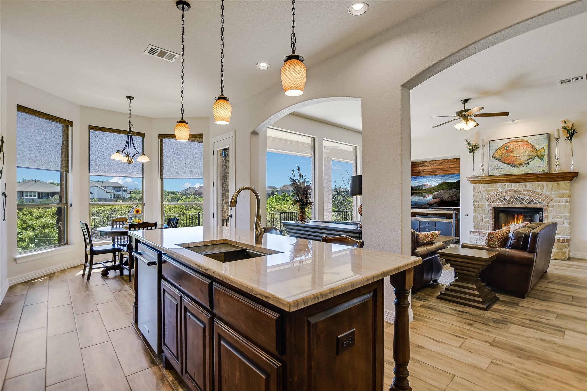 2404 First View Leander, TX 78641 - Photo 7 of 38 Exquisite Designer Quartz Counters and Kitchen Island Augmented by Georgeous Imported Italian Tile Flooring!