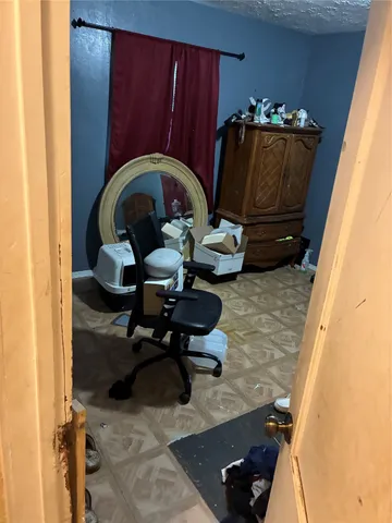 a room with furniture and wooden floor