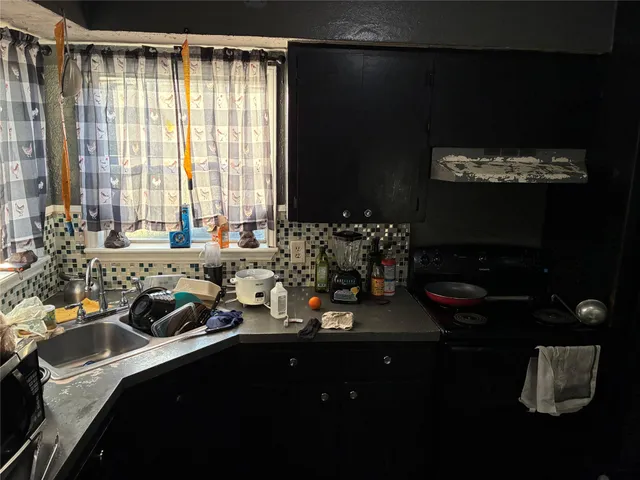 a view of hallway with furniture and wooden floor