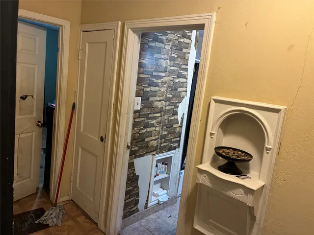 a bed room with a bed and a television