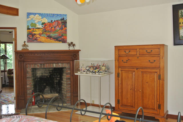 16 Averic Road Stockbridge, MA 01266 - Photo 12 of 24 a living room with furniture and a fireplace