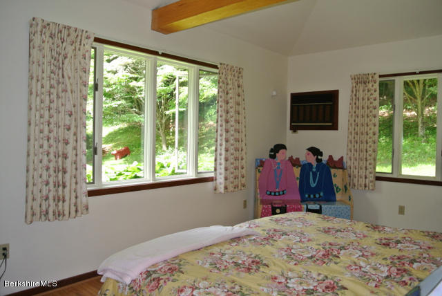 16 Averic Road Stockbridge, MA 01266 - Photo 16 of 24 a bed room with a bed and a window
