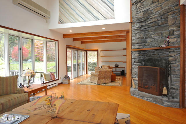 16 Averic Road Stockbridge, MA 01266 - Photo 5 of 24 a large living room with a large fireplace