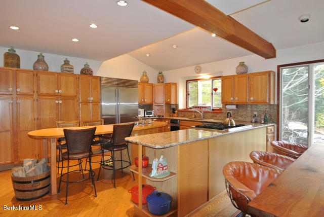 16 Averic Road Stockbridge, MA 01266 - Photo 7 of 24 a large kitchen with a table and chairs