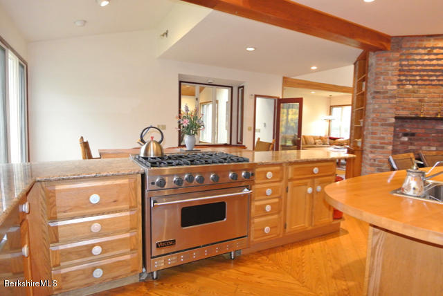 16 Averic Road Stockbridge, MA 01266 - Photo 8 of 24 a kitchen with stainless steel appliances granite countertop a stove and a sink