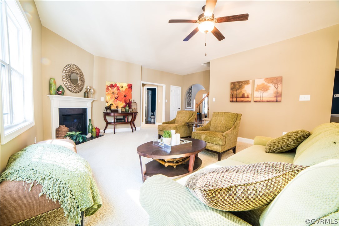 10819 Avening Road Chesterfield, VA 23832 - Photo 28 of 32 a living room with furniture a fireplace and a chandelier