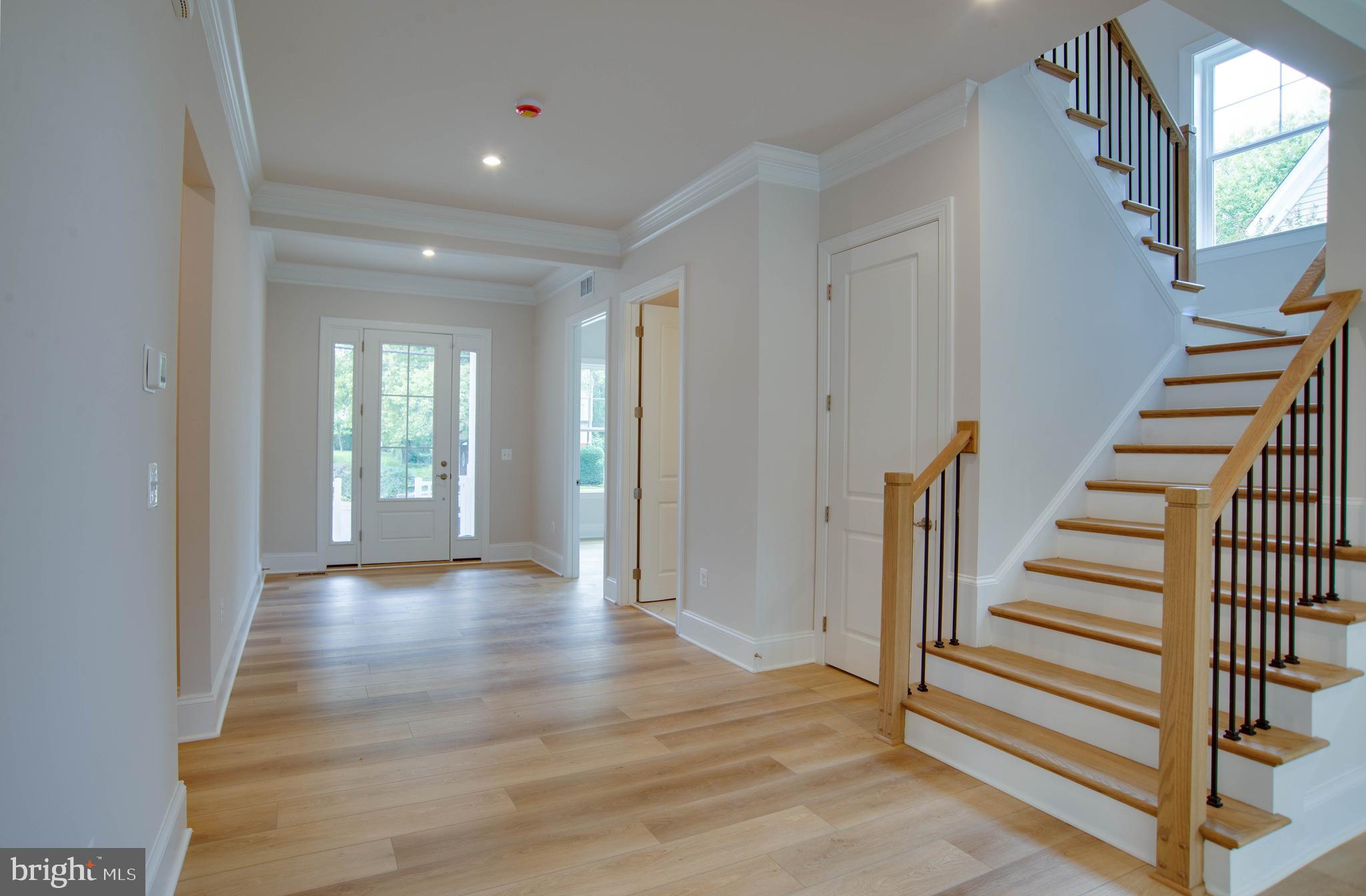 1419 Cottage Street Southwest Vienna, VA 22180 - Photo 14 of 34 a view of a hallway with wooden floor and stairs
