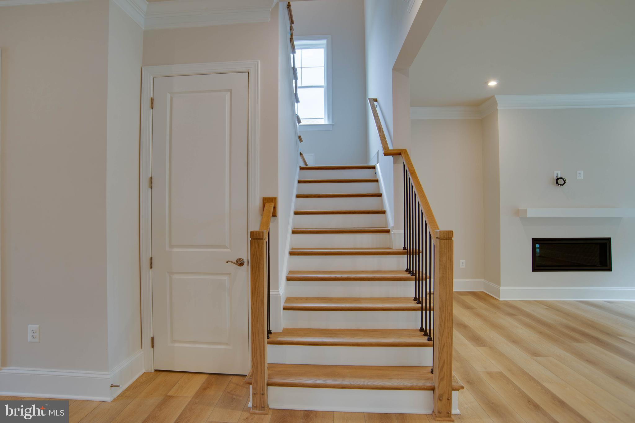1419 Cottage Street Southwest Vienna, VA 22180 - Photo 15 of 34 a view of a hallway with wooden floor and staircase
