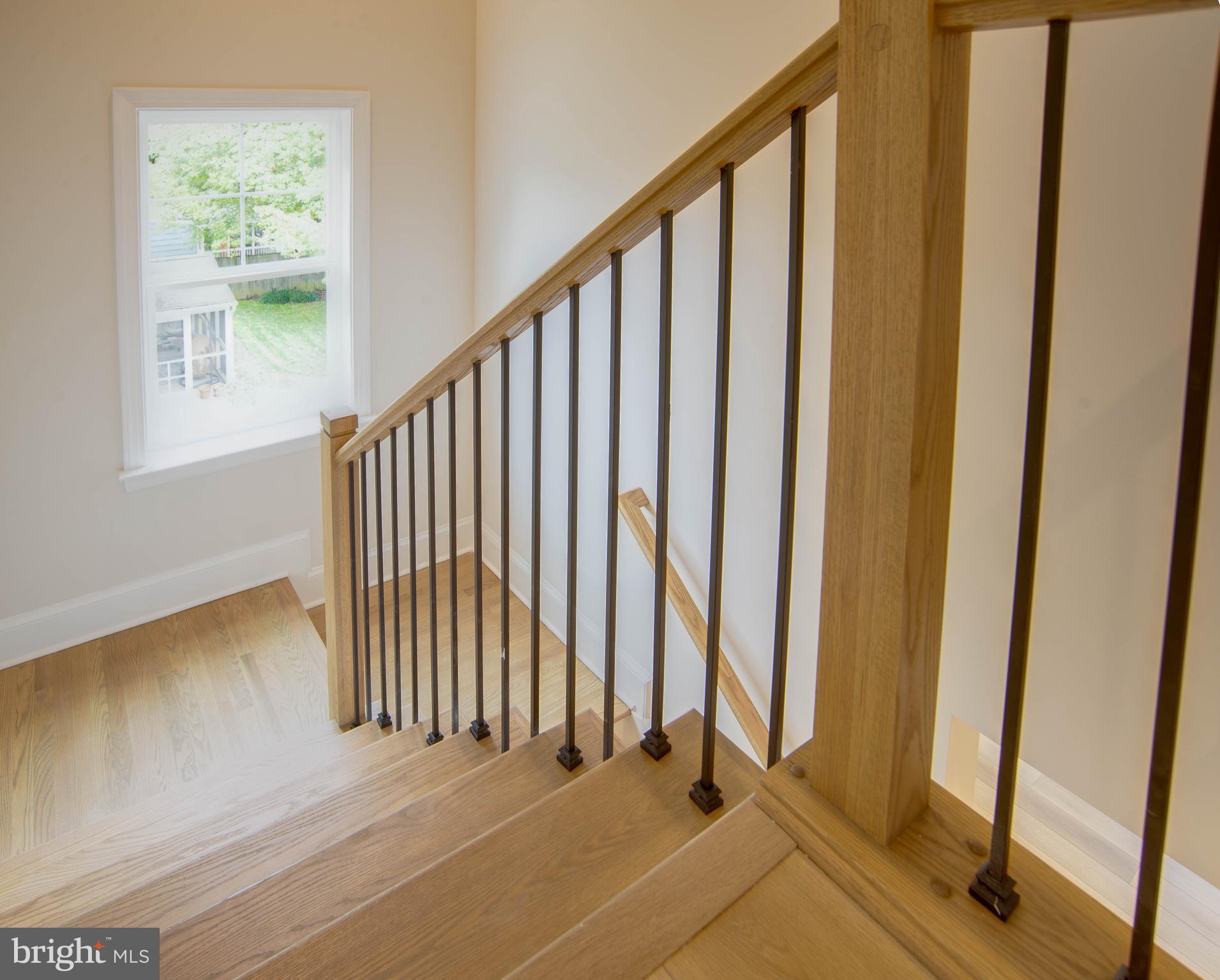 1419 Cottage Street Southwest Vienna, VA 22180 - Photo 16 of 34 a view of a room with wooden floor and windows