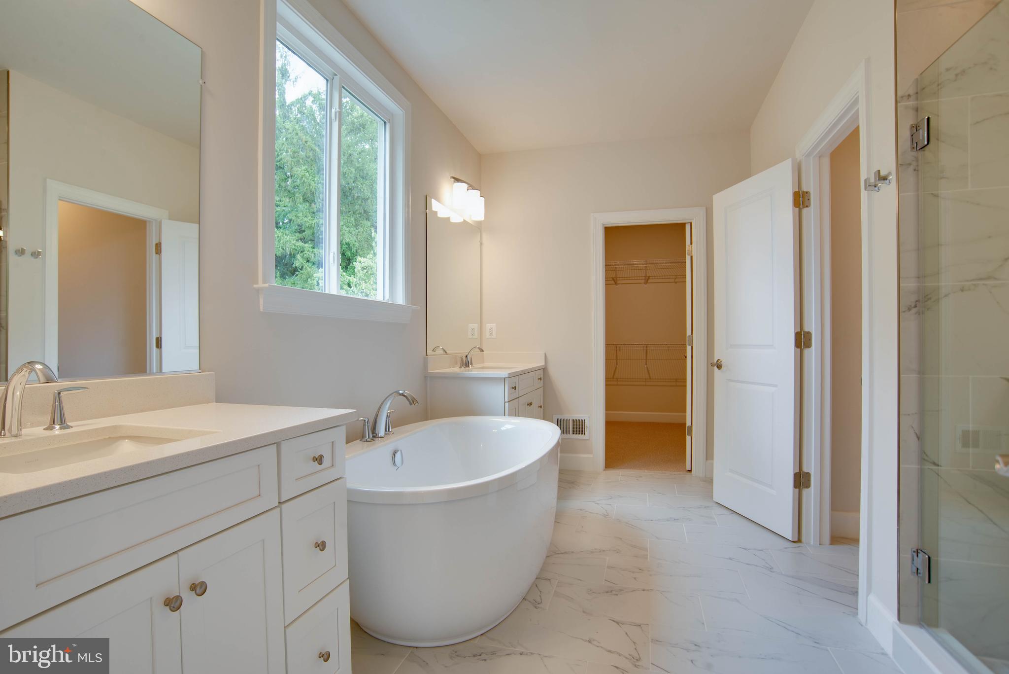 1419 Cottage Street Southwest Vienna, VA 22180 - Photo 19 of 34 a spacious bathroom with sink and mirror