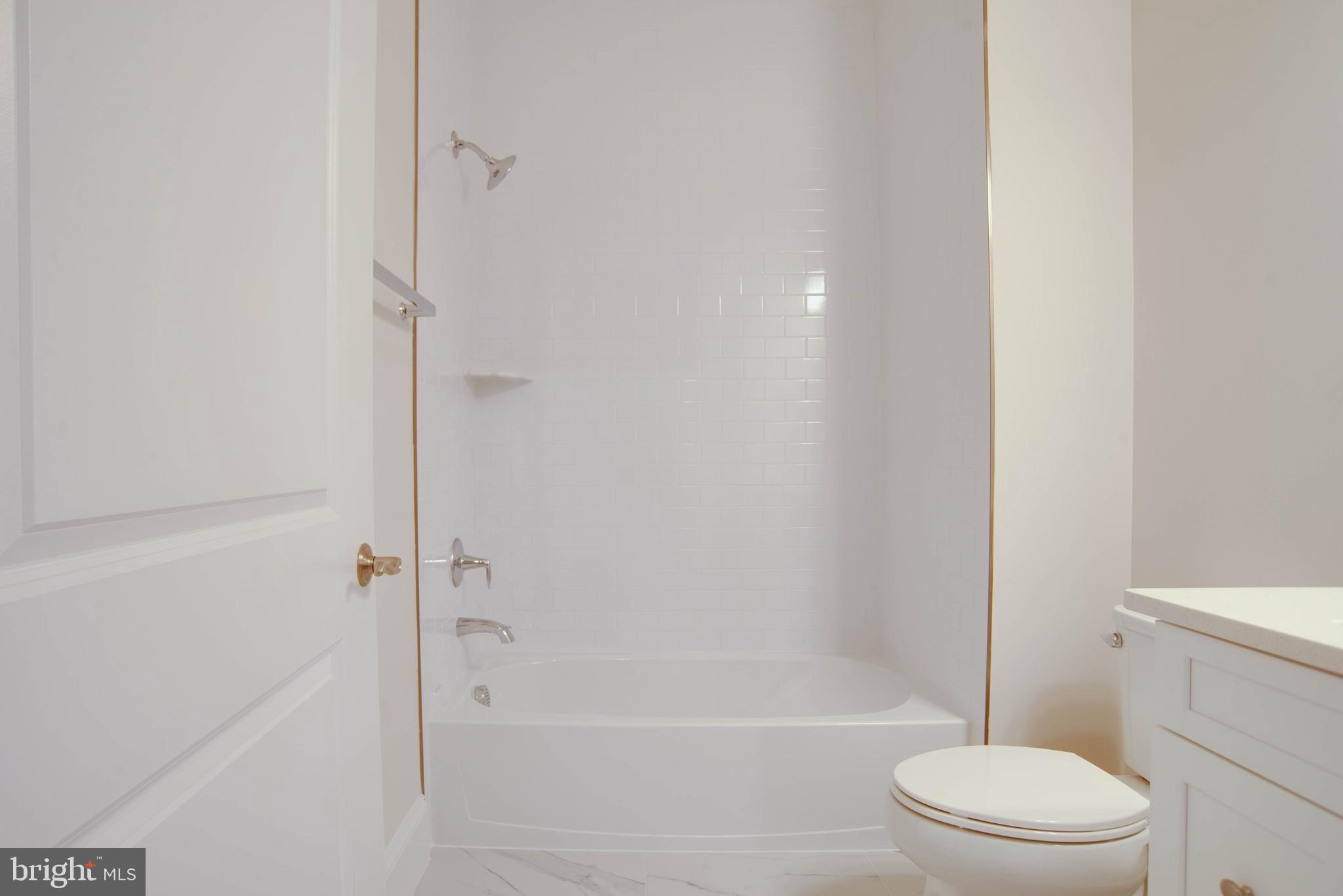 1419 Cottage Street Southwest Vienna, VA 22180 - Photo 4 of 34 a bathroom with a toilet and a shower