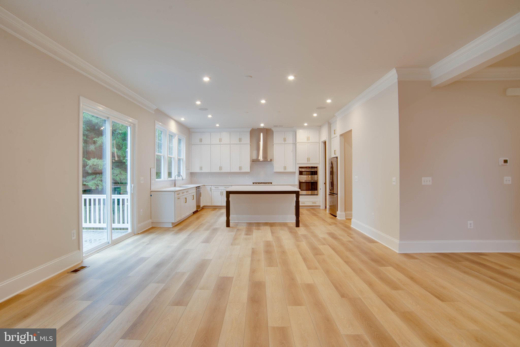 1419 Cottage Street Southwest Vienna, VA 22180 - Photo 5 of 34 a view of kitchen with wooden floor and large window