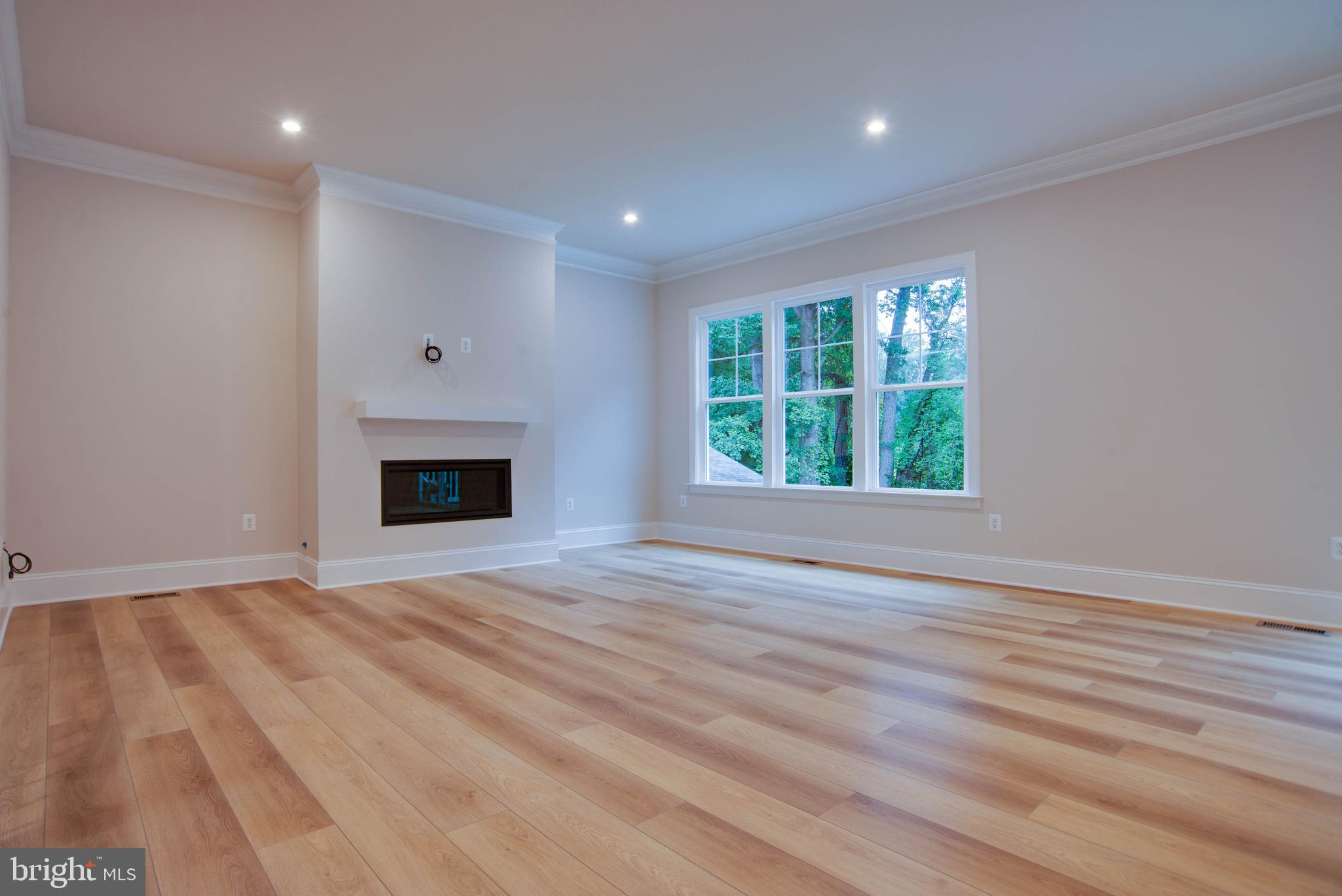1419 Cottage Street Southwest Vienna, VA 22180 - Photo 6 of 34 wooden floor in an empty room with a window