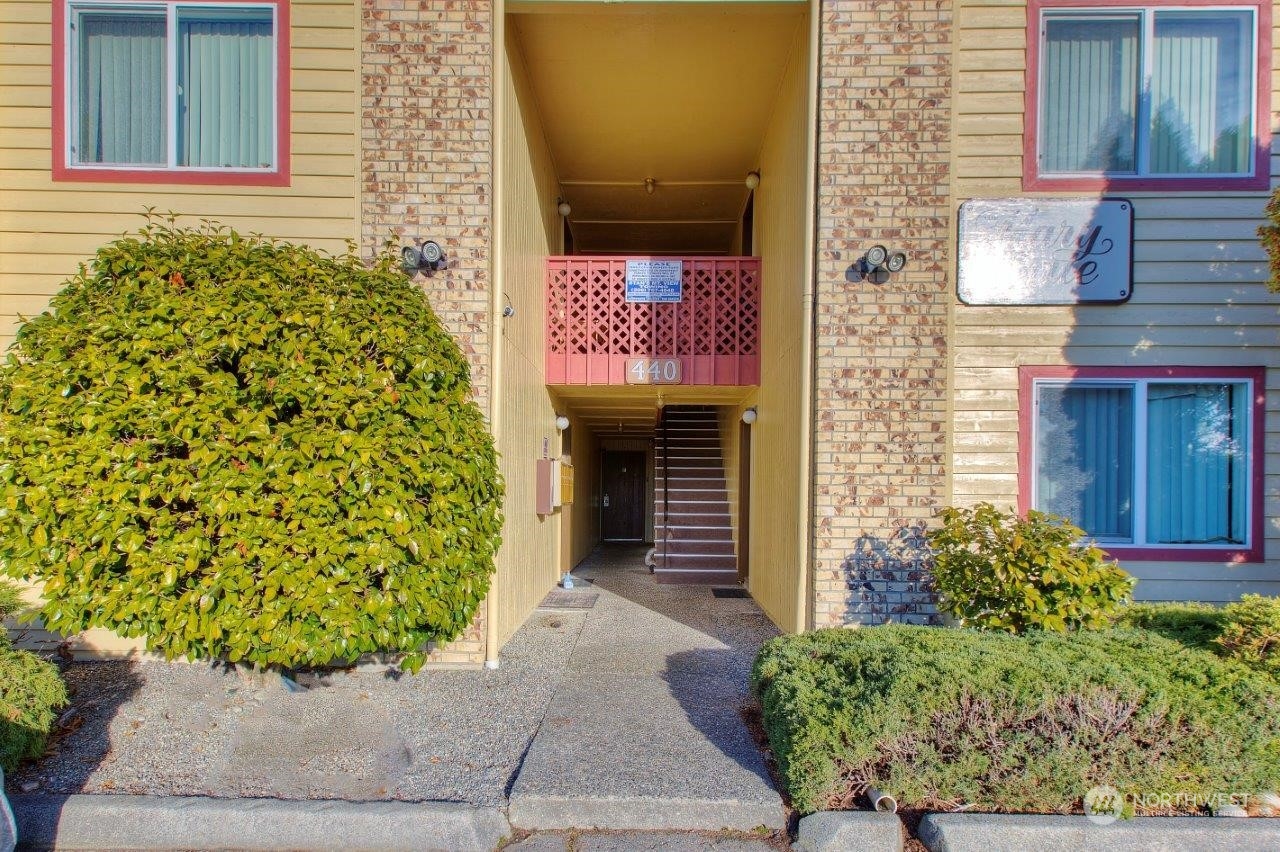 440 Southwest 155th Street Burien, WA 98166 - Photo 2 of 22 front view of a house with a door and a chair