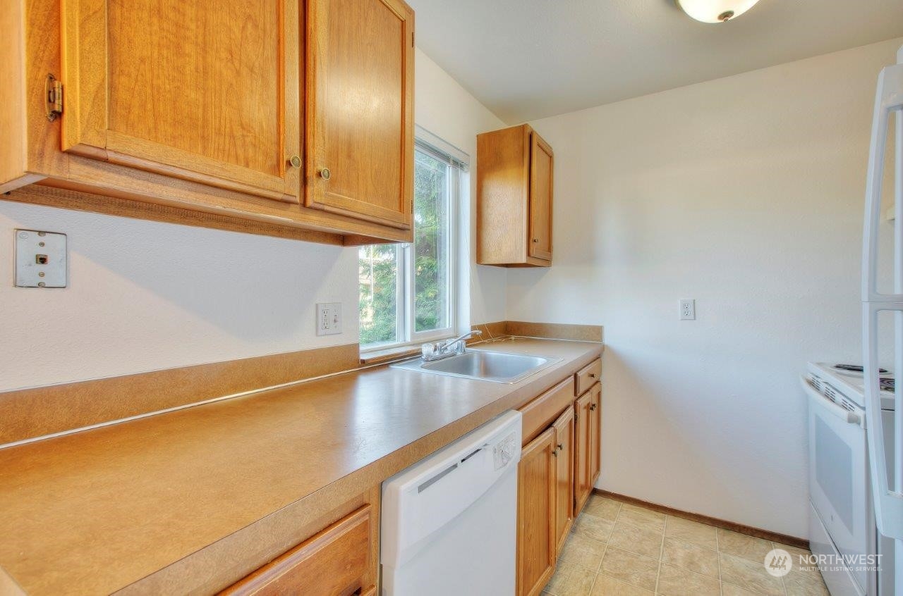 440 Southwest 155th Street Burien, WA 98166 - Photo 8 of 22 a utility room with cabinets