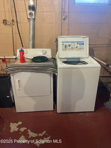 a utility room with washer and dryer