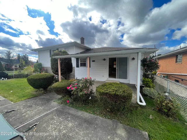a view of a house with a garden