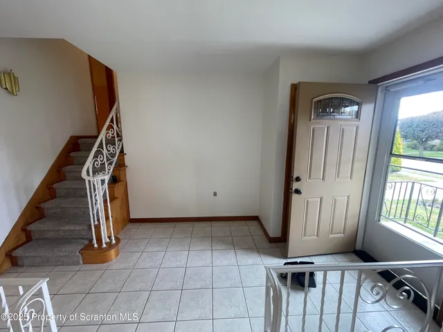 a view of an entryway with staircase