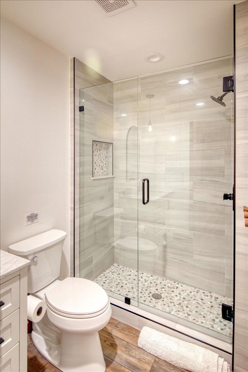 19811 West Ranch Road 152 Llano, TX 78643 - Photo 32 of 38 Full bath with a shower stall, vanity, and wood finished floors