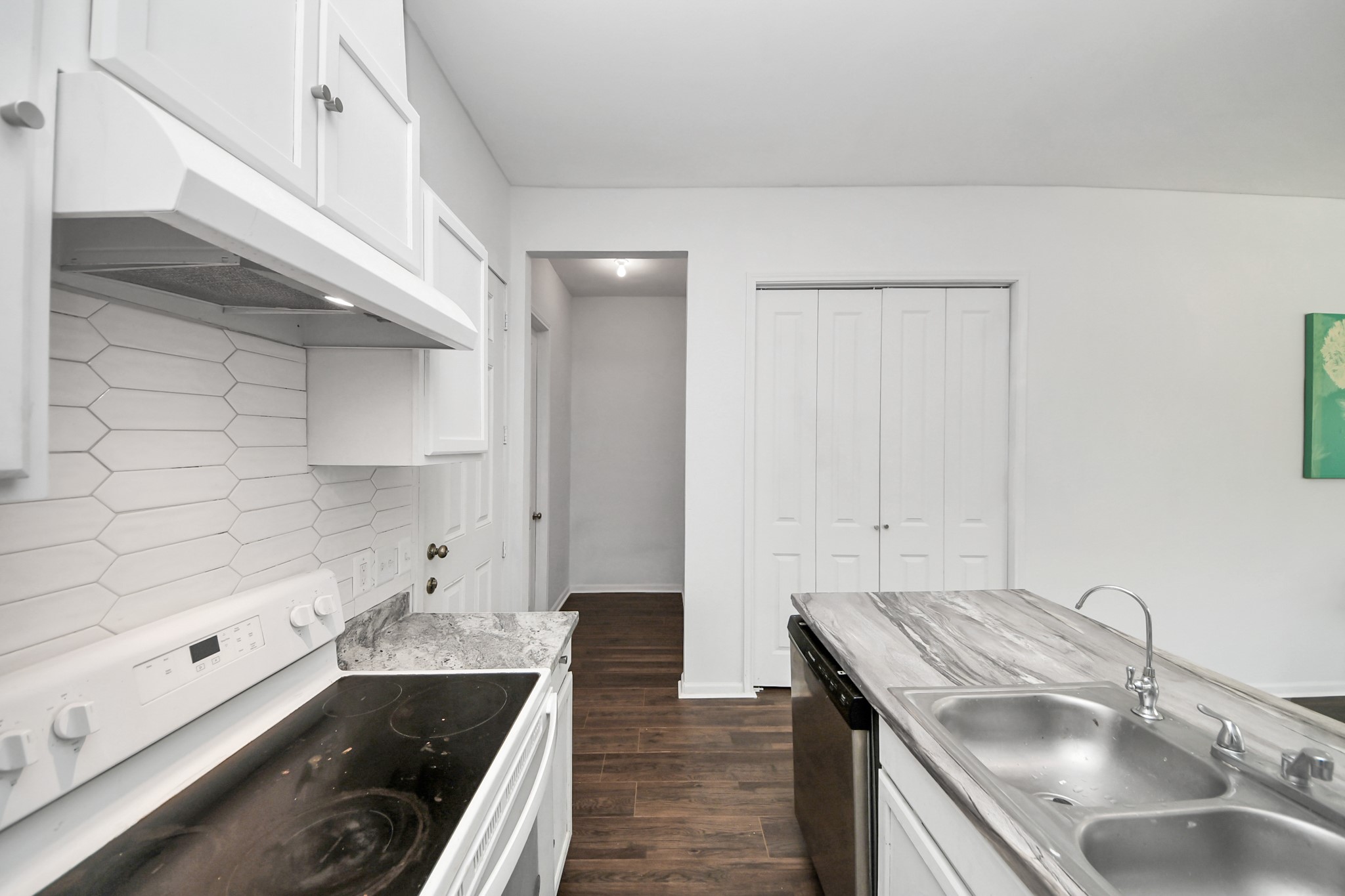 3011 Layne Street La Porte, TX 77571 - Photo 26 of 41 a kitchen with a sink stove and cabinets