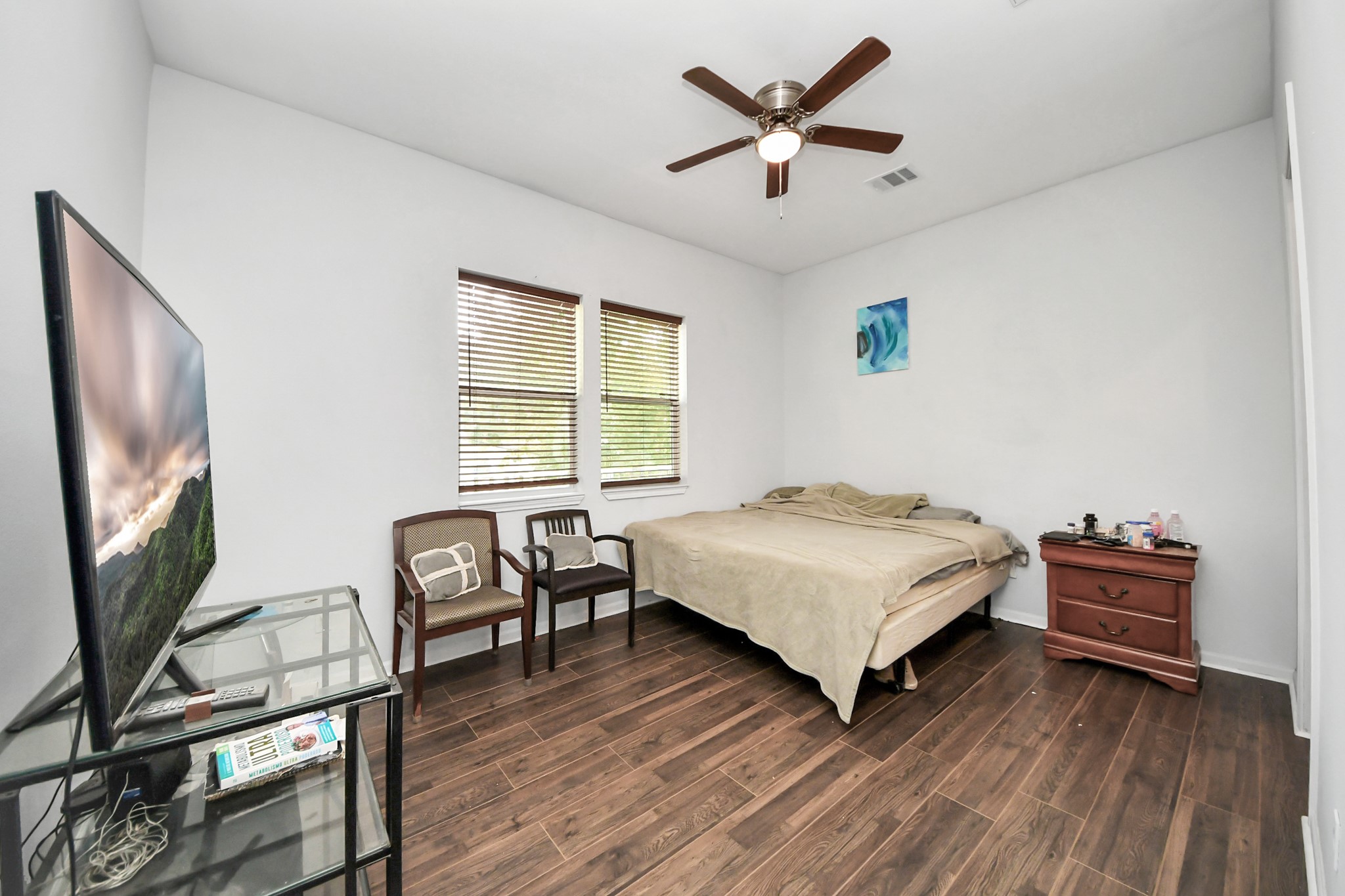 3011 Layne Street La Porte, TX 77571 - Photo 28 of 41 a bedroom with a bed and a flat screen tv