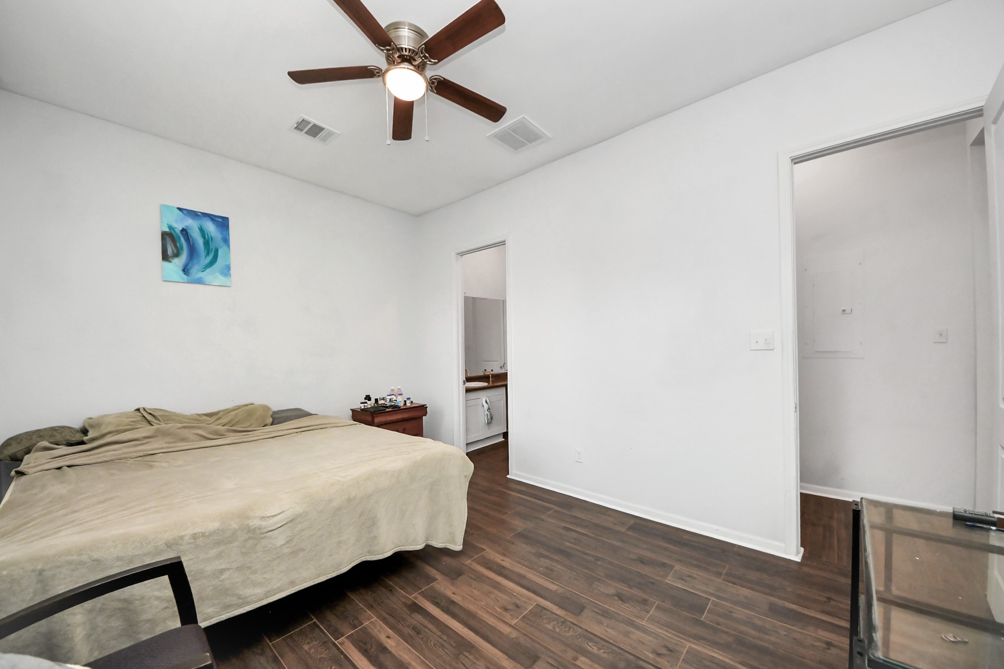 3011 Layne Street La Porte, TX 77571 - Photo 29 of 41 a bedroom with a bed and a ceiling fan