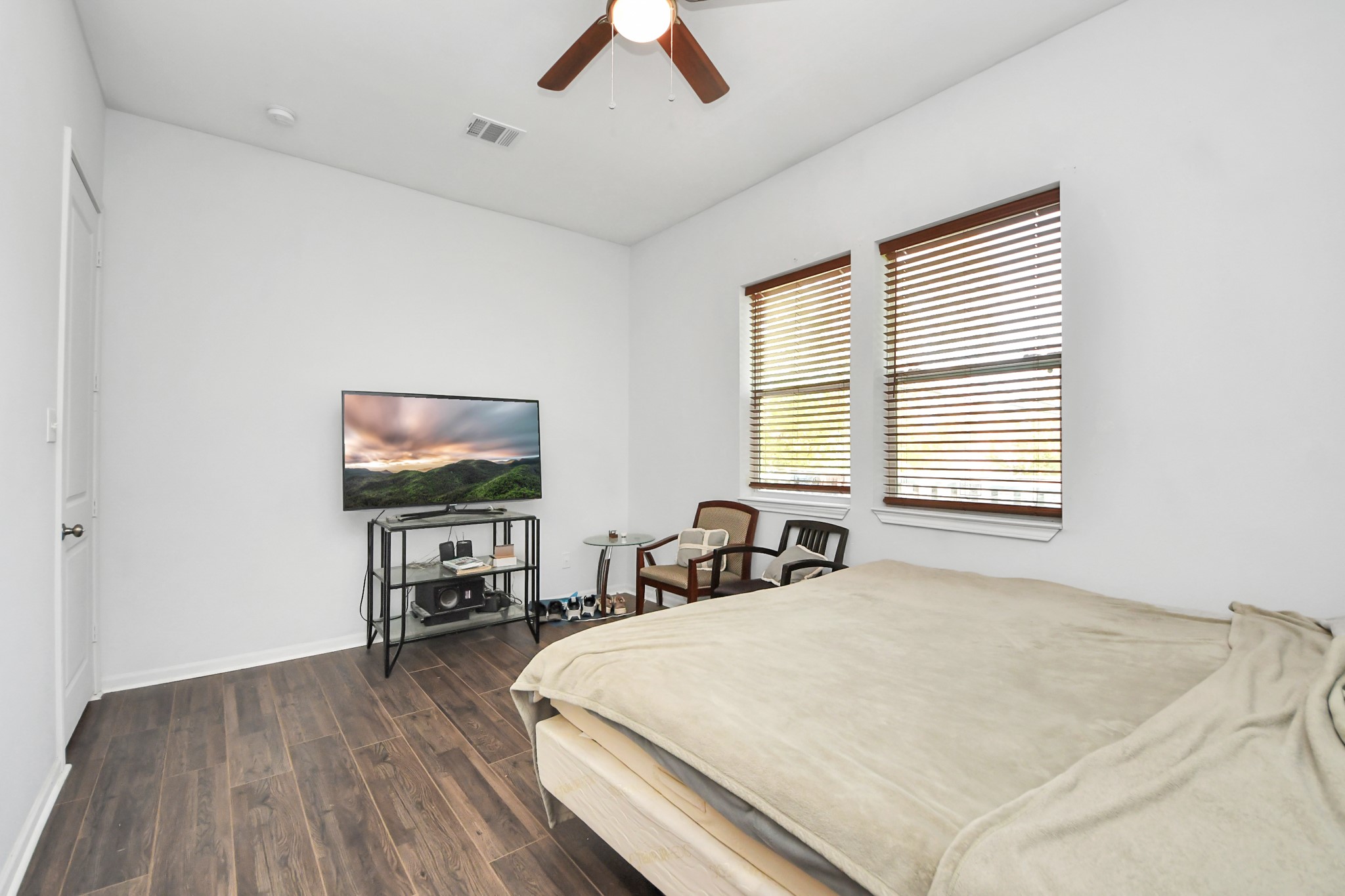 3011 Layne Street La Porte, TX 77571 - Photo 30 of 41 a bedroom with a bed and a flat screen tv