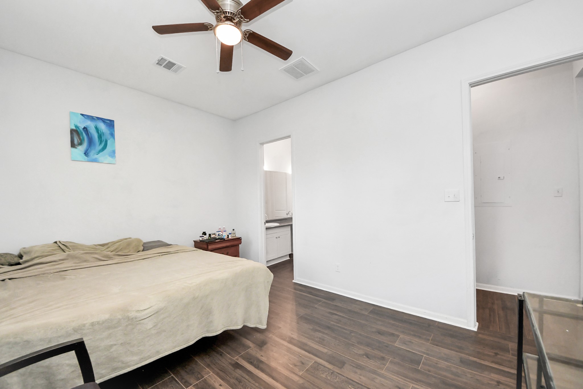 3011 Layne Street La Porte, TX 77571 - Photo 34 of 41 a bedroom with bed and wooden floor