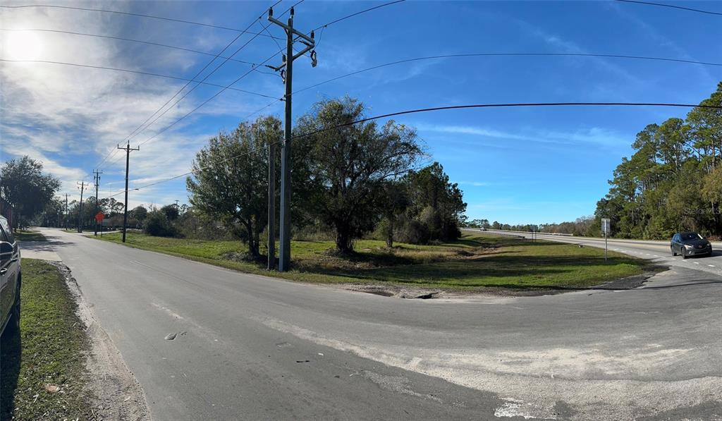 0 North State Street Bunnell, FL 32110 - Photo 7 of 13 a green field with tree in front of it