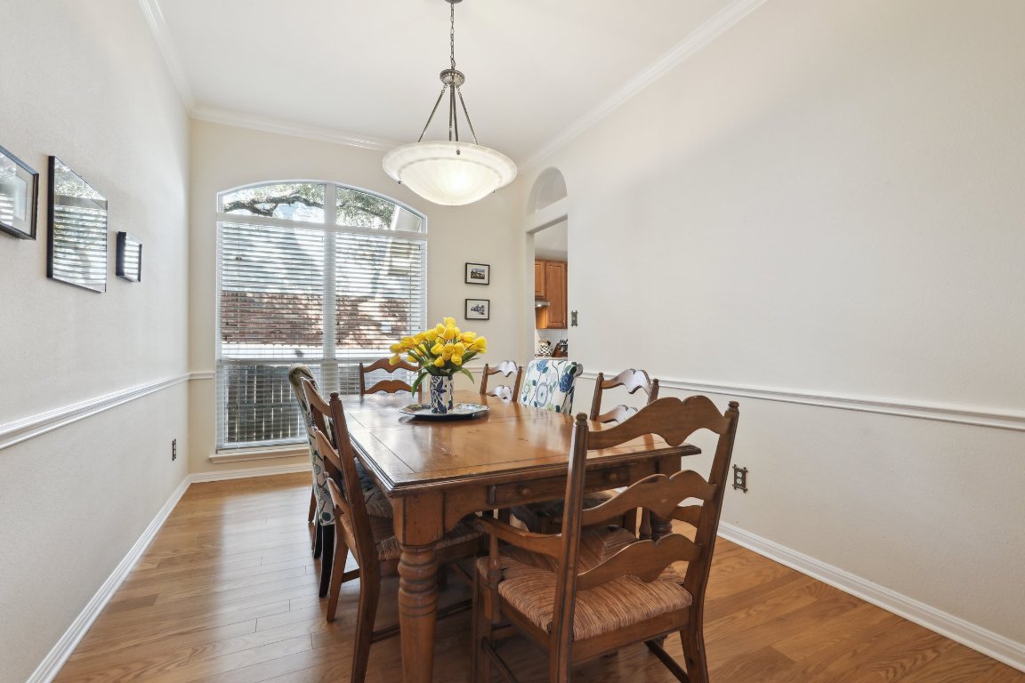3805 Pebble Court Round Rock, TX 78664 - Photo 13 of 31 a view of a dining room with furniture window and wooden floor