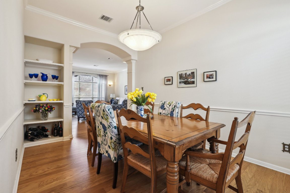 3805 Pebble Court Round Rock, TX 78664 - Photo 14 of 31 a view of a dining room with furniture and wooden floor