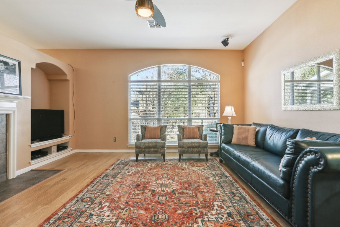 3805 Pebble Court Round Rock, TX 78664 - Photo 20 of 31 a living room with furniture and a flat screen tv