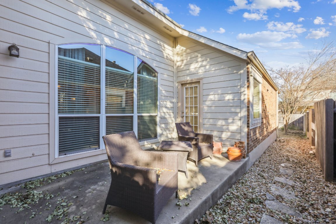 3805 Pebble Court Round Rock, TX 78664 - Photo 30 of 31 a roof deck with table and chairs and potted plants