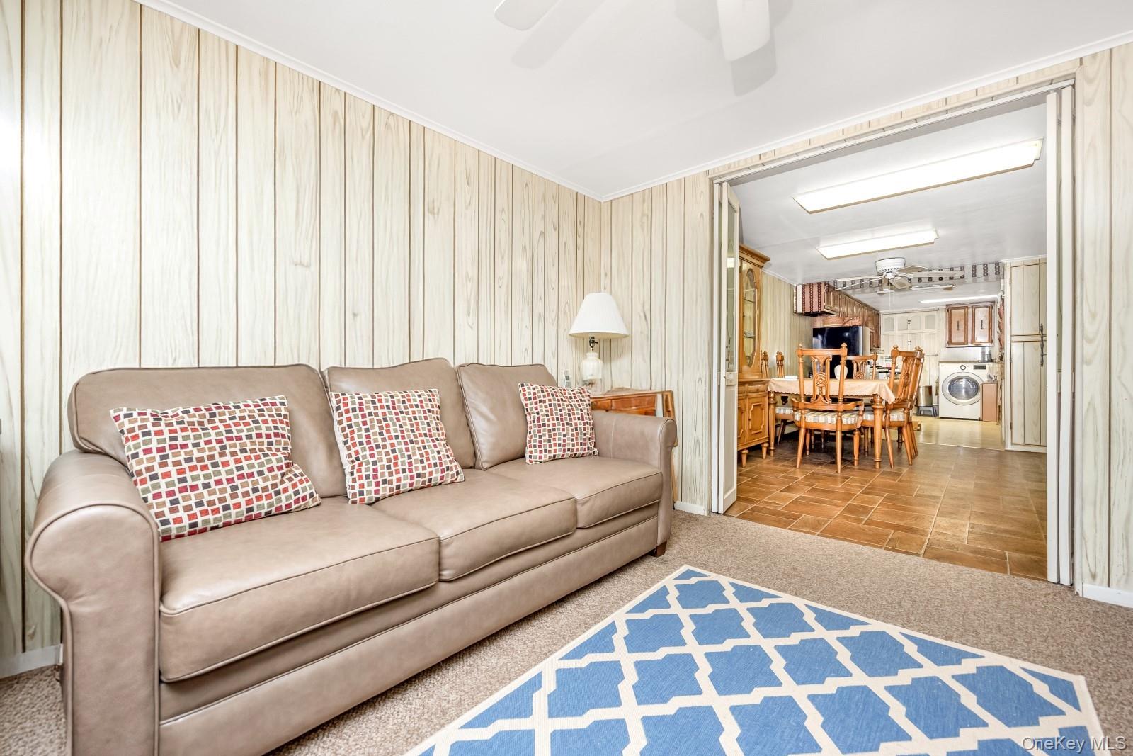 60-56 75th Street Queens, NY 11379 - Photo 24 of 30 a living room with furniture and a table