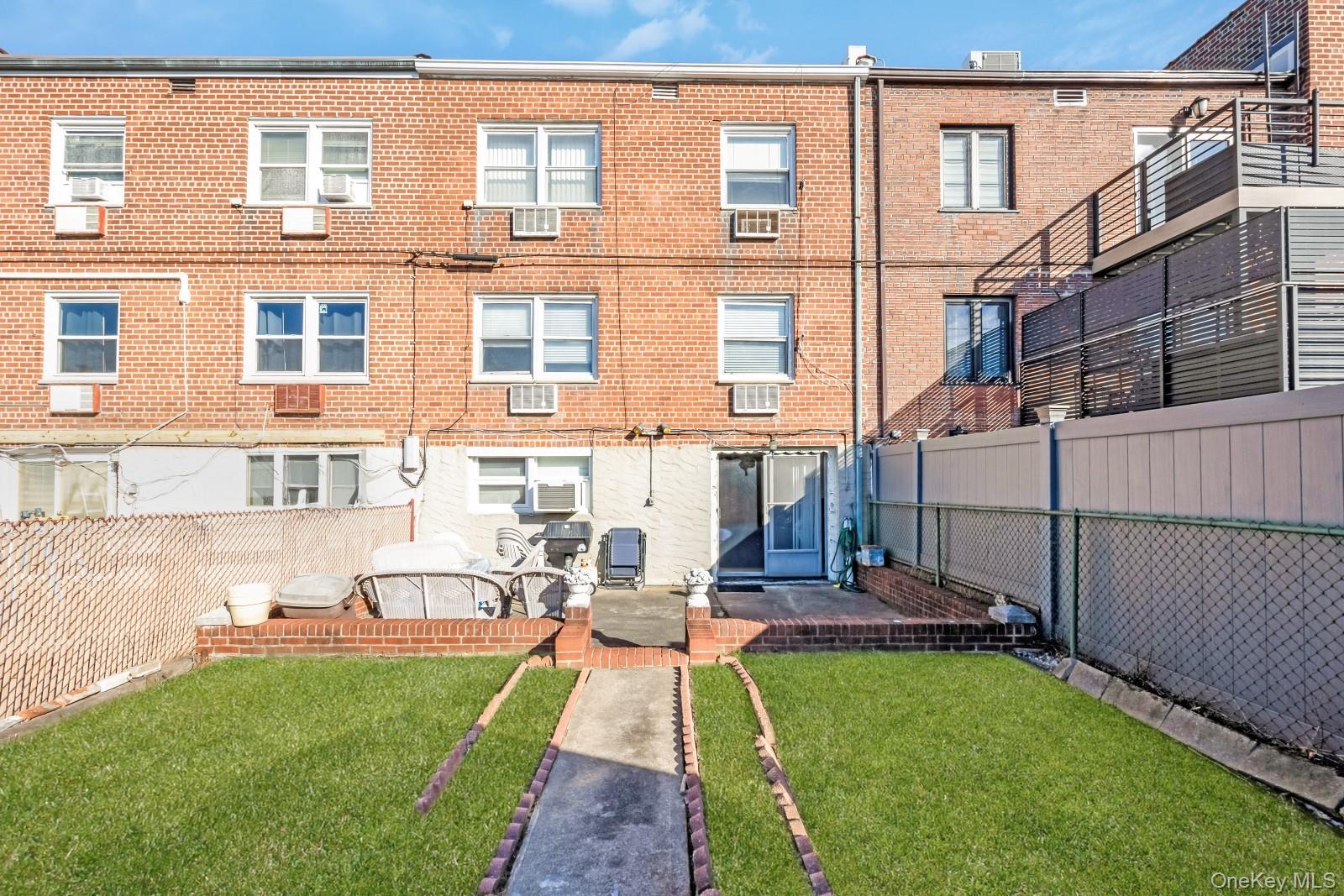 60-56 75th Street Queens, NY 11379 - Photo 30 of 30 a view of a patio with table and chairs and potted plants