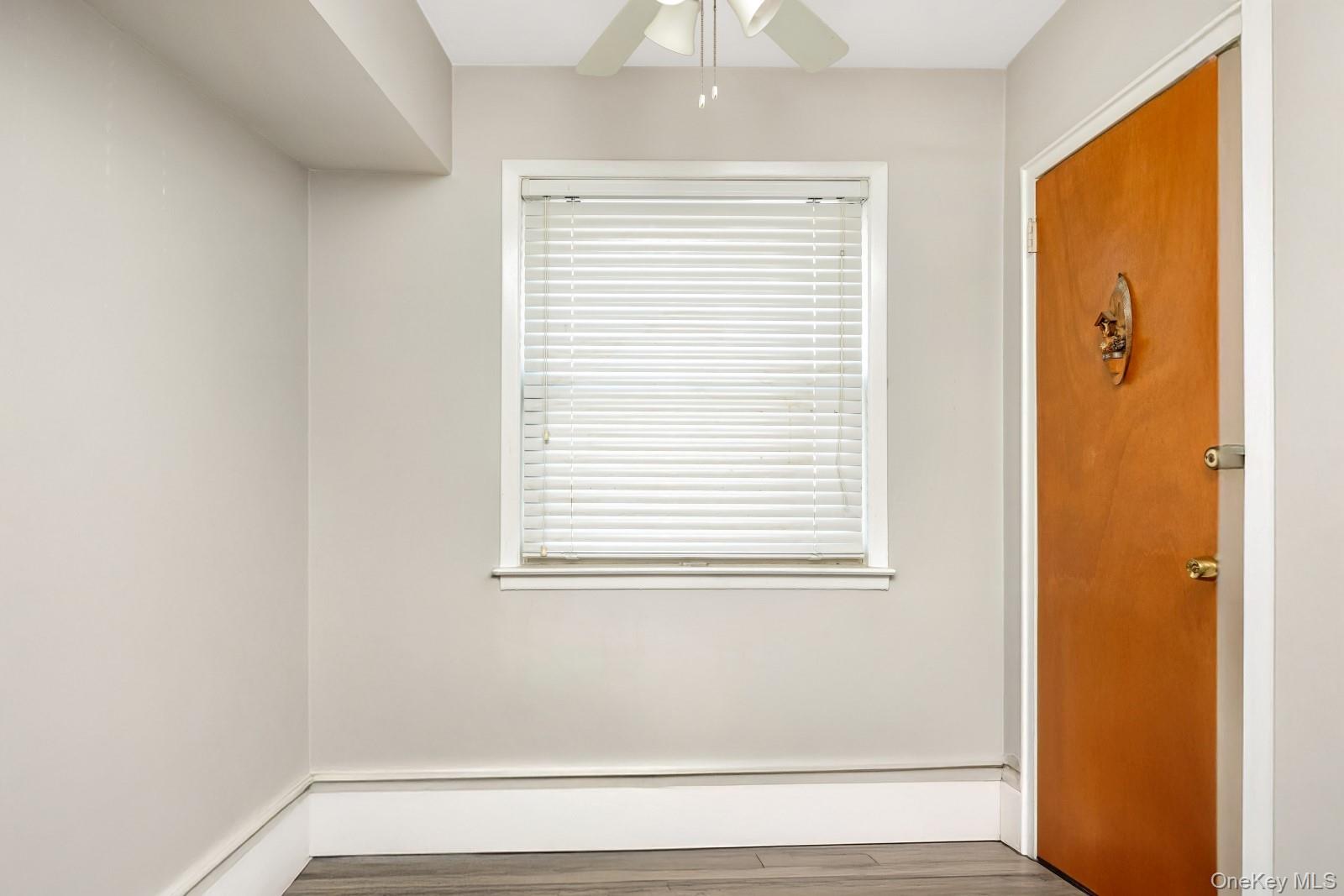 60-56 75th Street Queens, NY 11379 - Photo 8 of 30 a view of a room that has a window in it