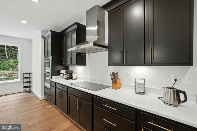 a kitchen with sink and cabinets